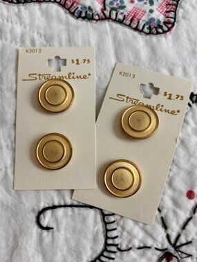 Vintage NOS Streamline brand metal buttons in a brushed gold finish